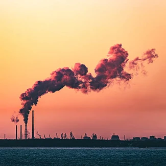 Factory Tata Steel with smoking chimneys on a sunny day, IJmuiden, The  Netherlands Stock Photo